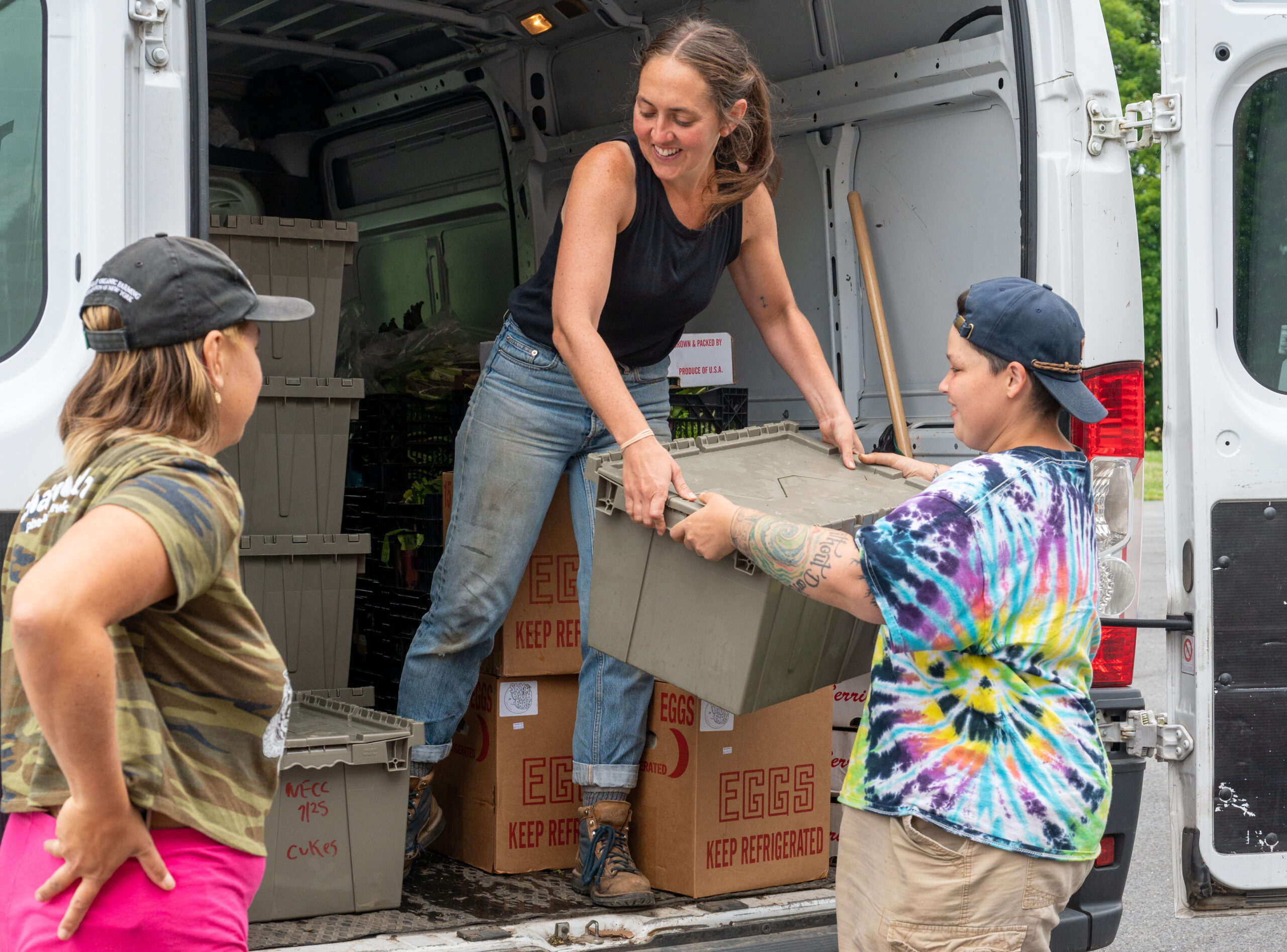 Staff of Long Table Harvest delivering produce to NECC.
